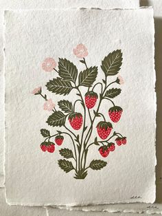 an image of strawberries and leaves on paper