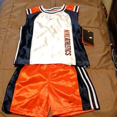 Navy/Orange/White Nike Shorts & Sleeveless Shirt Basketball Set, Embroidered Swoosh & Nike Athletics, New With Tag, Polyester, 12 Months Casual Orange Sleeveless Sets, White Sleeveless Sports Set, White Nike Shorts, Month Colors, White Nike, Kids Nike, Short Shirts, Nike Shorts, Sleeveless Shirt