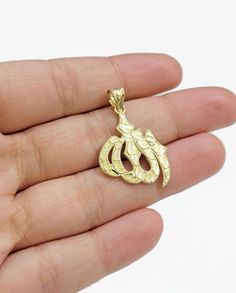 Real 10k Yellow Gold Allah Charm 1 Inch Pendant For Necklace & Chain SALE 10kt Metal :10k Yellow Gold Length  : 1 inch (approx.) Weight: 2-3 Grams (approx.) Charm type: Allah Charm  Make: Light Feel NOTE: CHAIN NOT INCLUDED.  Please allow up to +/- 10% difference in weight. The weight/width are approximate  RETURN DESCRIPTION:  To return a shipped item , please follow these steps:   1.You can return the item(s) within 30 days from the date of purchase. The item must be returned in its original packaging new with tag attached to item, with all gift boxes and accessories included, and without any signs of usage, abuse, or wear. Custom orders are non-refundable 2. Indicate the reason for your return in the Return Reason column on the packing slip next to the item you're returning. 3. Include Packing Slip, Chain Heart, Gold Nugget, Fine Jewellery Necklace, Necklace Chain, Gift Boxes, Online Jewelry, Chains Necklace, Custom Orders