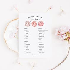 a printable wedding game with donuts on it and pink flowers in the background