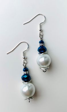 Pearl and Navy dangle earrings! Sparkles when it catches the light. Thank you for stopping by! Elegant Beaded Drop Earrings With French Hook, Elegant Beaded Earrings With French Hook As Gift, Party Jewelry With French Hook Dangle, Earrings Patterns, Beaded Earrings Patterns, Earring Patterns, Etsy Earrings Dangle, Ear Jewelry, The Light