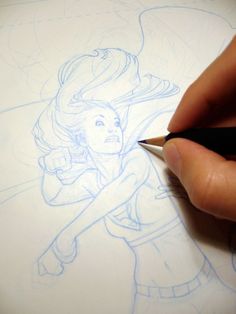 a drawing of a girl with long hair is being drawn by someone's hand