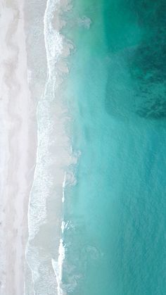 an aerial view of the beach and ocean