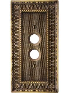 an old fashioned metal switch plate with two holes