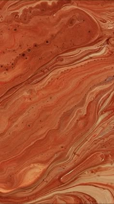 an orange and brown marble textured background