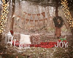 an image of a christmas scene in the woods with decorations and garlands on trees