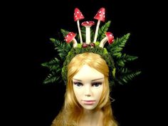 We always combine shipping and refund for the overages. This is a listing for a handmade fairy crown. This fairy crown was crafted by the fairies in my magical workshop. It is a crown for adults. It can be worn by both males and females, it is unisex. There are 5 big faux mushrooms in the middle. There are 2 smaller mushrooms in front of the larger ones. The crown is covered in moss and decorated with faux leaves in the back. The crown is covered with felt which is also on the inside which makes Fairycore Fairy Dress For Halloween Cosplay, Halloween Fairycore Dress For Cosplay, Halloween Fairycore Fairy Dress Costume, Fantasy Costume Hat With Tall Crown For Cosplay, Fantasy Tall Crown Costume Hat For Cosplay, Halloween Fairycore Fairy Dress, Whimsical Crown Costume Hats And Headpieces For Parties, Handmade Fantasy Headpieces, Whimsical Costume Hat With Tall Crown For Parties