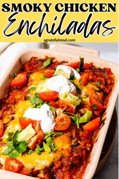 an enchilada in a casserole dish with sour cream on top