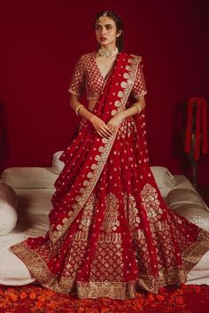 Royal red banarasi lehenga with gold embroidered borders all over flare. Comes with fitted blouse and dupatta.
Component: 3
Pattern: Embroidered
Type Of Work: Gold embroidery
Neckline: V Neck
Sleeve Type: Half sleeves
Fabric: Organza, Georgette, Satin ,Cotton, Banarasi
Color: Red
Other Details: 
Gold heavy embroidered borders
Occasion: Bride - Aza Fashions Red Bridal Lehenga, Embroidery Organza, Dupatta Dress, Sari Lehenga, Organza Bridal, Red Lehenga Choli, Pakistani Bridal Dress, Bridal Dupatta, Pakistani Designer Clothes