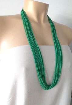 Long jade green beaded necklace,seed bead necklace, boho necklace, seed bead jewelry,bridesmaids necklace,multistrand beaded necklace. It has 12 strands and it comes in all lengths. Choose either silver or gold clasp at checkout.  Choose length at checkout! The size shown is 30". More jade items: https://www.etsy.com/shop/StephanieMartinCo?search_query=jade❤ SIZESThis item comes in several sizes, kindly choose at checkout. The easiest way to find out which length suits you best is to measure a n Green Multi-strand Necklace With Tiny Beads, Green Tiny Multi-strand Beads, Bridesmaids Necklace, Orange Necklace, Green Beaded Necklace, Bronze Necklace, Minimalist Bracelet, Bridesmaid Necklace, Seed Bead Necklace