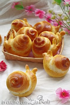 several small pastries in a basket on a table