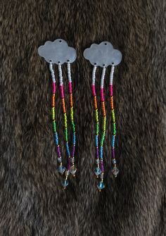 Created by an Inspired Indigenous woman. ✨️   These lightweight neon rainbow earrings offer the perfect vibe for summer!       Made in Ontario, Canada with neon Czech beads, 24k gold beads, crystal bicone beads, nylon thread, and cloud-shaped findings. Rainbow Beaded Earrings For Summer Festival, Rainbow Dangle Earrings For Summer, Rainbow Drop Earrings For The Beach, Rainbow Drop Earrings For Beach, Summer Rainbow Beaded Earrings, Cloud Beaded Earrings, Fun Rainbow Beaded Earrings, Rainbow Seed Bead Earrings, Summer Rainbow Beaded Dangling Earrings