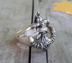 "Detailed anchor ring With interwining snake sterling silver. Weights 8 gms approx,depending on the size Length 20mm (6/8\") Width 16mm (5/8\")" Silver Nautical Jewelry With Adjustable Fit, Adjustable Nautical Silver Jewelry, Silver Nautical Rings As Gifts, Nautical Style Silver Rings For Gift, Silver Nautical Style Ring As A Gift, Silver Nautical Rings For Gift, Anchor Ring, Silver Snake Ring, Anchor Rings