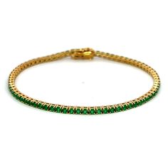 Indulge in a touch of luxury with our exquisite 2.45 Cts Green Onyx Tennis Bracelet. Boasting the finest quality green onyx stones, this bracelet exudes sophistication and elegance. Perfect for any occasion, its timeless design and exceptional craftsmanship will elevate your style to new heights. GEMSTONE 2.45 RD TCW 75 PCS. GREEN ONYX14K YG 7.75 GRAMS SIZE 7.25 BW-026 Green Diamond Bangle Bracelet For Formal Occasions, Formal Emerald Gemstone Bracelets, Formal Green Diamond Bangle Bracelet, Luxury Green Tennis Bracelet For Formal Events, Green Gemstone Diamond Bracelet For Formal Occasions, Luxury Round Emerald Bracelets, Luxury Emerald Tennis Bracelet Gift, Formal Green Diamond Bracelet With Gemstone, Green Emerald Bracelets For Formal Occasions