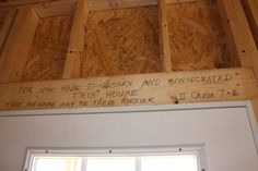 the inside of a house that is being built with wood and plywood on it