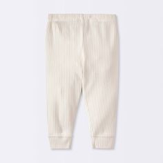 The 3-Pack Wide Ribbed Pants from cloud island™ adds a touch of texture to your baby's wardrobe. Made from stretchy cotton material, the mid-rise ankle pants are soft and comfortable to wear. The full elastic waistband makes dressing baby a breeze, while the banded leg openings keep the pants securely in place. Pair with almost any top in their closet or layer over bodysuits for comfortable dressing options. cloud island™: Designed with love. Made without compromise. Neutral Pants, Ribbed Pants, Cloud Island, Solids For Baby, Gender Neutral Baby Clothes, Bottom Clothes, Ankle Pants, Baby Boy Outfits, Jogger Pants