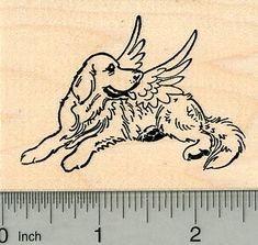 a rubber stamp with an image of a dog on it's back and wings