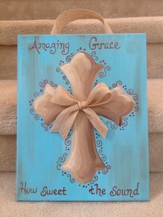 an image of a cross painted on a wood block with the words, amazing grace and how sweet the sound