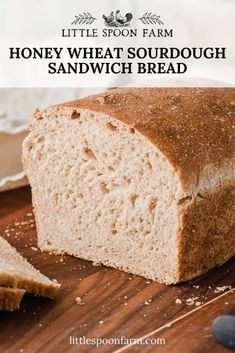 a loaf of honey wheat sourdough sandwich bread on a cutting board