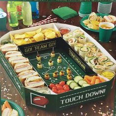 an image of a football party with snacks and drinks on the sidelines in a box