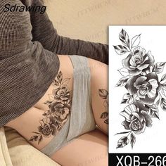 a woman with flowers tattoo on her thigh and the bottom half of her panties is shown