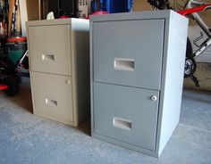 two gray filing cabinets sitting next to each other in a garage with bikes and tools