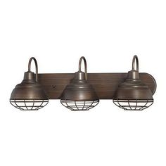 three light bronze finish bathroom fixture with caged glass shades on the sides and an open bulb