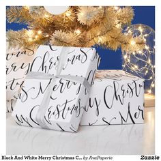 three wrapped presents under a christmas tree with the words merry christmas written in black and white