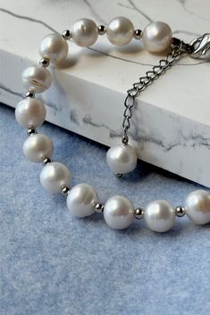 Freshwater pearl bracelet in silver tone beads cottagecore white jewelry by MarinaMiJewelry. Pearl necklace Coquette Old Money Aesthetiс | Gift for her. Accentuate your style with our freshwater pearl bracelet, adorned with silver tone beads, embodying the charm of cottagecore white jewelry. This pearl bracelet, inspired by Coquette Old Money Aesthetic, makes for a delightful and timeless gift for her, adding an elegant touch to any occasion. Silver Baroque Pearl Bracelet With Pearl Chain, Everyday Silver Beaded Bracelet With Pearl Charm, Silver Baroque Pearl Bracelets With Round Beads, Silver Bracelet With Baroque Pearls, Dainty Silver Pearl Beaded Bracelets, Silver Pearl Beaded Bracelets Minimalist Style, Minimalist Silver Pearl Beaded Bracelets, Silver Baroque Pearl Bracelet With Round Beads, Minimalist Silver Beaded Bracelet With Pearl Charm