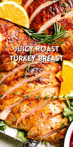 juicy roast turkey breast on a platter with oranges and cranberry sauce