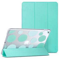 an ipad case with polka dot design on the front and back cover in mint green