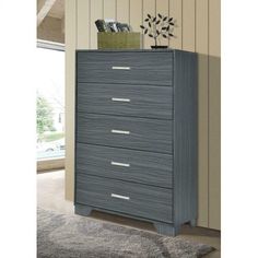 a gray dresser with drawers in a room