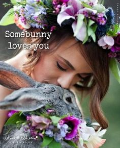 a woman kissing a bunny with flowers on her head and the words feli dominoo