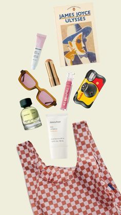 the contents of a shopping bag laid out on top of each other, including sunscreen, lip balm, eyeglasses and lipstick