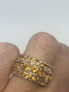 Unusual cut of citrine surrounded by small citrines Sterling Filigree gold finished Setting Handmade Size 7 Can be resized, my jeweler charges a $10-$20 fee All rings are shipped in a nice gift box. Check out our over a THOUSAND great reviews Engraving is $4 per letter and is not always perfect depending on the piece. It can take a few days if the jeweler is busy. This is payable to Paypal Judithsltd@gmail.com Amber Topaz Ring For Anniversary, Gold Citrine Crystal Ring For Anniversary, Yellow Faceted Topaz Ring For Anniversary, Gold Citrine Gemstones, Anniversary Yellow Citrine Gemstones, Anniversary Yellow Citrine Topaz Ring, Anniversary Yellow Topaz Citrine Ring, Yellow Faceted Topaz Anniversary Ring, Gold Citrine Crystal Ring With Prong Setting