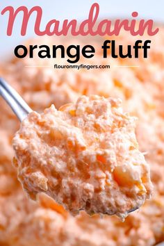 a spoon full of orange fluff with the words mandarin orange fluff above it