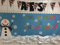 a bulletin board that says our school is snow cool with a snowman on it