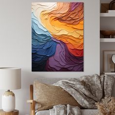 a living room scene with focus on the couch and colorful painting hanging above it's head