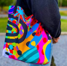 Embrace the rainbow with this stunning tote, a canvas of color for your daily journey! * 100% spun polyester fabric * Bag size: 15″ × 15″ (38.1 × 38.1 cm) * Capacity: 2.6 US gal (10 l) * Maximum weight limit: 44lbs (20 kg) * Dual handles made from 100% natural cotton bull denim * Handle length 11.8″ (30 cm), width 1″ (2.5 cm) * The handles can slightly differ depending on the fulfillment location * Blank product components sourced from China Casual Multicolor Canvas Shopping Bag, Trendy Multicolor Canvas Bags, Vibrant Multicolor Bags For Summer, Vibrant Multicolor Summer Bags, Colorful Tote Beach Bag For Shopping, Summer Multicolor Canvas Bag With Large Capacity, Multicolor Canvas Travel Bag For Summer, Casual Multicolor Canvas Tote Bag, Trendy Multicolor Canvas Bag For Everyday