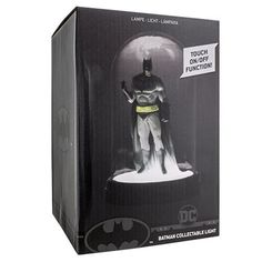 the batman light - up lamp is in its box and it's on display