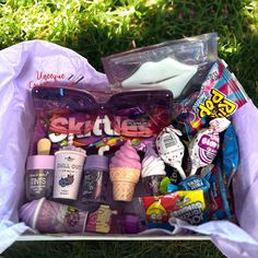 the contents of an ice cream sundae in a plastic bag on the grass outside