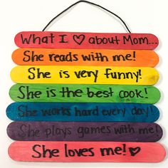 a wooden sign that says, what i love about mom she reads with me she is very funny