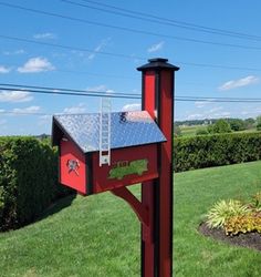 a mailbox in the shape of a house