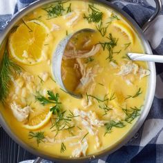 a pot filled with chicken and lemon soup