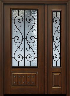 a wooden door with glass panels and decorative iron work on the top part of it