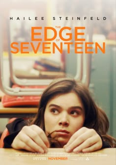 the edge of seventen movie poster with a girl peeking out from behind a table