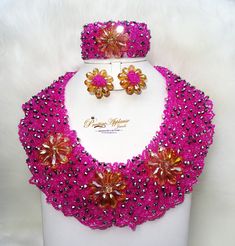 PrestigeApplause Pink with Silver Mixed with Gold Elegant Latest New Design African Beads Bridal Wedding Party Jewelry Set Complete Set is Necklace Earring and bracelet Wedding Party Bridal Special Occasion This detailed Jewellery set makes you stand out elegantly in any special occassion, it's all about glamour and uniqueness.  Buying more that 2 Jewellery set, we offer wholesale and bulk prices for all our jewellery. Multicolor Beaded Bridal Necklace For Party, Handmade Pink Bridal Necklace For Wedding, Crystal Beaded Necklaces With Rhinestones For Wedding, Crystal Beaded Necklaces For Party With Round Beads, Party Crystal Beaded Necklaces With Round Beads, Crystal Beaded Bridal Necklace For Party, Beaded Bridal Necklace With Round Beads For Parties, Multicolor Faceted Beads For Wedding, Pink Crystal Beaded Necklaces