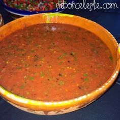 a large bowl filled with lots of red sauce