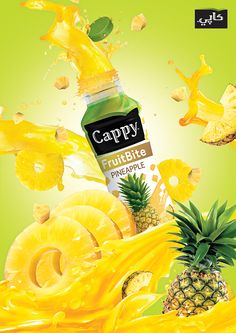 a bottle of cappy fruitie pineapple juice surrounded by sliced pineapples