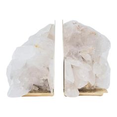 two pieces of white rock sitting on top of each other in front of a white background